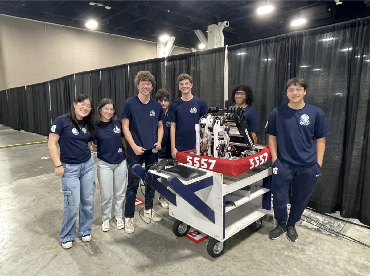 The BB-R8ERS smile for a photo parked next to their robot in Fort Lauderdale. They then went on to place into the finals in the South Florida Regionals. (Photo by Joseph Buttrick used with permission)